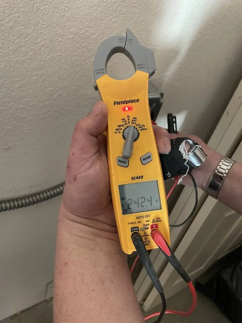 Voltage testing with clamp meter during Recessed Lighting Installation in Juno Beach